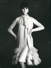 Mar. 03, 1965 - Paris dressmakers show Spring and Summer collections. Photo shows Silk evening dress and coat trimmed with ostrich feathers at the bottom. Designed by Pierre Cardin.