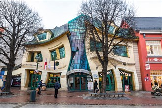 SOPOT, POLAND - NOVEMBER 30, 2016: Crooked little house (Polish: "Krzywy Domek") is an unusually shaped building in Sopot, Poland. Built in 2004, it's
