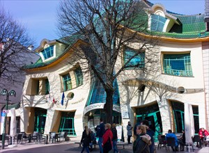 Krzywy Domek ("crooked little house" in Polish) is a quirky building and is part of the Rezydent shopping centre.