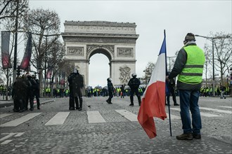 Paris, France - 8 December 2018: Yellow Vests (Gilets jaunes) protests against living costs and rising oil prices