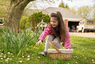 Young girl on a easter egg hunt