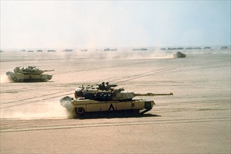 A US Army M-1A1 Abrams main battle tank from the 3rd Armored Division, moves across the desert into Kuwait during Operation Desert Storm February 15, 1991 in Kuwait.