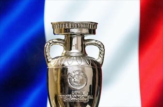 April 10, 2021. Paris, France. UEFA European Championship Cup with the French flag in the background.