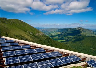 Solar farm with solar panels array in rural Cantal, Auvergne, France, Europe
