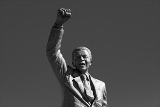 Artistic black and white portrait of a bronze statue near the Drakenstein Correctional Centre in Paarl near Cape Town, South Africa.