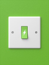 3d rendered front view of a single green light switch with a power symbol in the off position on a green background.