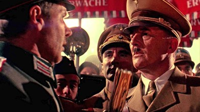 INDIANA JONES AND THE LAST CRUSADE 1989 Paramount Pictures film with Harrison Ford at left and Michael Sheard as Adolf Hitler