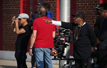 Chicago, USA. 07th July, 2015. "Chi-raq" director of photography Matty Libatique, left, and Spike Lee, right, direct a scene before filming on 63rd Street in Chicago on Tuesday, July 7, 2015. © Abel U...
