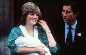Diana, Princess of Wales, wearing her favourite maternity dress, with newly-born baby Prince William and the Prince Charles, Prince of Wales in June 1982.