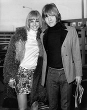 The Rolling Stones guitarist Brian Jones with his girlfriend Anita Pallenberg at the airport