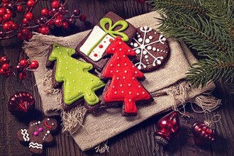 Chocolate christmas cookies on a wooden brown background