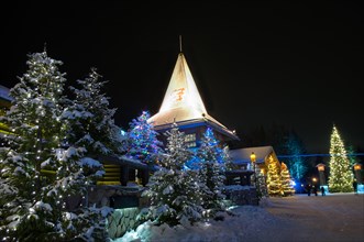 Santa Claus Village in Finland surrounded by Christmas trees