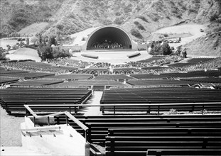 An orchestra plays on the stage of the Hollywood Bowl during the day, Los Angeles, California, 1931. (Photo by Burton Holmes)