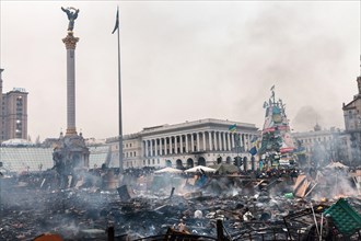 KIEV, UKRAINE - February 19, 2014: Mass anti-government protests in the center of Kiev. Barricades at on Independence Square after a night of fights