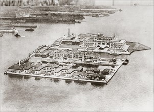 Vintage early 20th century press photograph:
Ellis Island, New York, aerial view, 1920's.