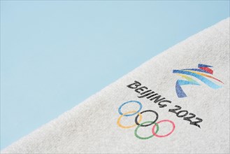 14 December 2021 - Los Angeles, USA: Beijing 2022 Winter Olympic Games and towel. International sport event. Winter Olympics 2022 in Beijing, China