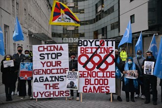 London, UK. 04th Jan, 2022. Activists hold placards expressing their opinion during the No Beijing 2022 protest.Supporters of Tibet, Hongkong, Uyghurs and Anti-CCP activists gathered opposite BBC Broa...