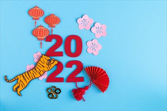 Chinese New Year, year of the tiger. Paper decoration with traditional motifs and tiger on blue background. Copy space.