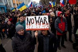 Moscow, Russia. 15th March, 2014 People hold anti-war banners during the Peace March by the Boulevard ring of central Moscow in support of the Ukrainian people and against military action