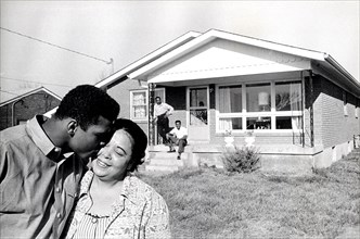 MUHAMMAD ALI  about 1965 with mother Odessa at the family home in Louisville, Kentucky.. Father Cassius & brother Rudolph behind