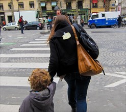 Paris, France, Woman with Paper Fish taped to back, April Fool's Day Trick, walking away, rear, on Street, rue royale