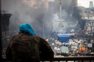Kiev, Ukraine. 20th Feb, 2014. A view of maidan square with a protester during clashes in central Kiev. At least 25 protesters were killed on February 20 in fresh clashes between thousands of demonstr...