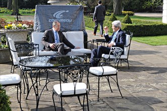 US Secretary of State John Kerry and Russian Foreign Minister Sergey Lavrov hold a brief one-on-one conversation on the patio at Winfield House before the start of a formal bilateral discussion focuse...