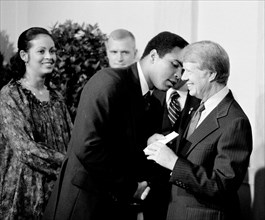 President Jimmy Carter greets Muhammad Ali at a White House dinner celebrating the signing of the Panama Canal Treaty, Washington, D.C. 1977