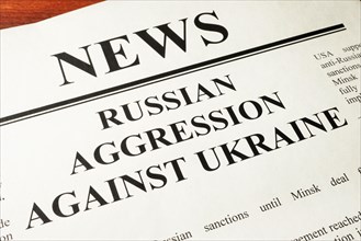 Newspaper with word news and Russian Aggression Against Ukraine.