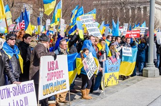 Washington DC, USA - March 6, 2014: People holding sign of Vladimir Putin and Russia during Ukrainian protest by White House