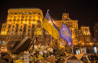 Kiev, Ukraine - February 26, 2014:  Barricades with tires and flags in Kiev on Maidan Square during the revolution in the Ukraine.