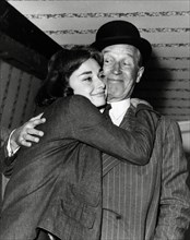 Audrey Hepburn embracing Maurice Chevalier during the making of the film, "Love In The Afternoon" 1957 Allied Artists File Reference # 33536_265THA