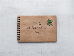 St.Patrick 's Day. Beautiful card. Sketchbook with congratulatory inscription
