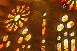 Stained-glass windows of the Sagrada Família (Basílica de la Sagrada Família) designed by Catalan modernist architect Antoni Gaudí in Barcelona, Catalonia, Spain. The stained-glass windows in the west...