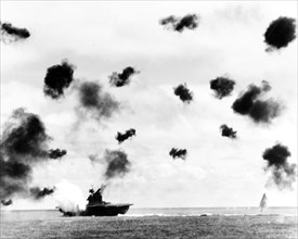 Battle of Midway, June 1942. USS Yorktown (CV-5) is hit on the port side, amidships, by a Japanese Type 91 aerial torpedo during the mid-afternoon attack by planes from the carrier Hiryu, 4 June 1942....