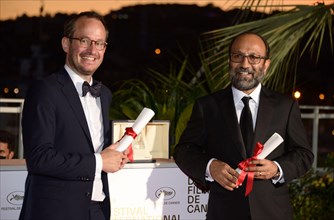 July 17, 2021, CANNES, France: Juho Kuosmanen and Asghar Farhadi pose with the 'Grand Prix' Ex-Aequo for 'Hytti nro 6' and for 'A Hero' during the 74th annual Cannes Film Festival on July 17, 2021 in ...