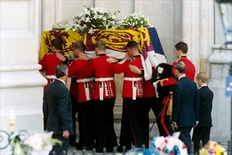 The coffin of the Princess of Wales is carried into Westminster Abbey, followed by the Prince of Wales and Prince Harry.