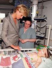 Diana, Princess of Wales, visits eighteen month old Vessa Kahramani during her visit to the Paediatric Intensive Care Unit at St Mary's Hospital in London on April 22, 1997.
