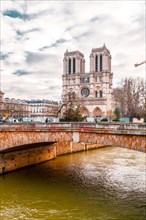 Paris, France - January 20, 2022: The Notre Dame de Paris is a medieval Catholic cathedral on the Ile de la Cite (an island in the Seine River), in th