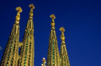 Spires of the Sagrada Familia cathedral at dusk, Barcelona, Spain.