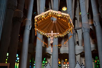 Altar with sculpture of Jesus on cross, Sagrada Familia interior, Barcelona, Catalonia, Spain