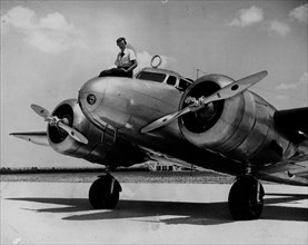 Amelia Earhart in a 1937 file image. Researchers hope images from her departure from Miami Municipal Airport may hold clues to her disappearance during an attempted around-the-world flight. © Miami He...