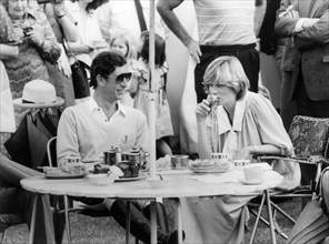 DIANA, PRINCESS OF WALES with Prince Charles at a Windsor polo match about 1980