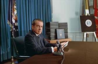PRESIDENT RICHARD NIXON (1913-1994) with his edited transcripts of the White House Tapes subpoenaed by the Special Prosecutor, during his televised speech  on Watergate  on 29 April 1974. Photo: White...