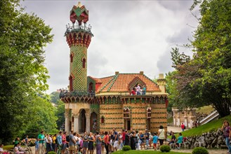 Tourists viewing the distinctive Folly or El Capricho by Antoni Gaudi in Comillas, Cantabria, Spain