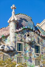 Barcelona Catalunya View of the mosaic tiled exterior facade of  Casa Batllo designed by architect Antoni Gaudi barcelona spain eu europe Catalonia