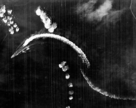Japanese aircraft carrier Hiryu maneuvering during a high-level bombing attack by USAAF B-17 bombers, shortly after 8AM, 4 June 1942 during Battle of Midway
