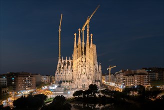 Night view of the Sagrada Familia, a large Roman Catholic church in Barcelona, Spain, designed by Catalan architect Antoni Gaudi.