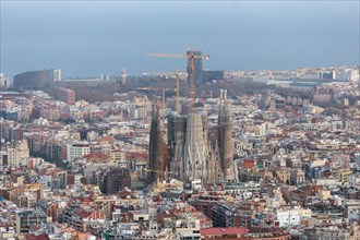Barcelona, Spain - March 27, 2018: Beautiful panorama view of Barcelona city with famous Sagrada Familia church at sunset, Spain