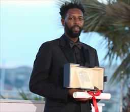 Cannes, France. 25th May, 2019. CANNES, FRANCE - MAY 25: Director Ladj Ly, winner of the Jury Price award for his film "Les Miserables" poses at the photocall for Palme D'Or Winner during the 72nd Can...